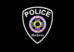 A Belen Police Department badge on a black background.