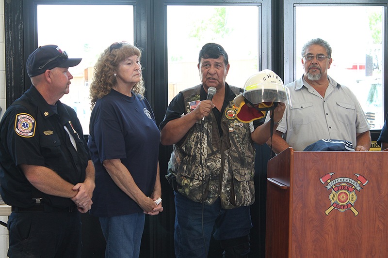 Throughout the decades, Belen fire chiefs have traditionally worn the No. 801 helmet. During the Belen Fire Department’s 100th anniversary celebration, current Chief Nathan Godfrey, far left, as well as former chiefs, from left, Lenore Pena, Frank Ortega and Wayne Gallegos, along with Belen firefighters and community members gathered to celebrate the men and women of the department.