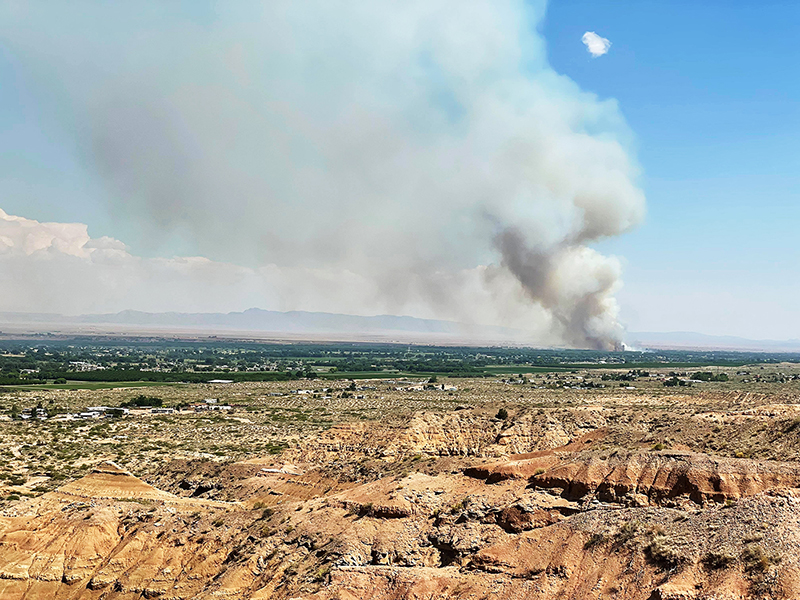 After driving to the end of Desi Loop and walking about a half mile to the edge of Belen’s west mesa, Jesse Espinoza was able to capture the massive smoke plume from the Cemetery Fire, which scorched 319 acres of bosque north of N.M. 346.