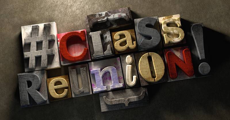 Class Reunion title on wooden ink splattered printing blocks. Grungy typography on a concrete background. Eduvation themed title for reuniting old school friends and class mates